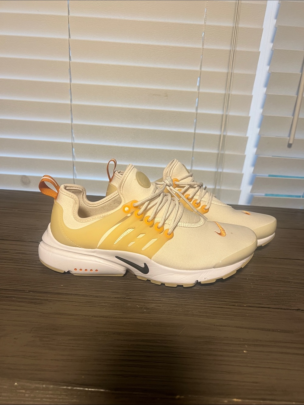Nike Women’s Slip-On Sneakers in Cream and Yellow Accents